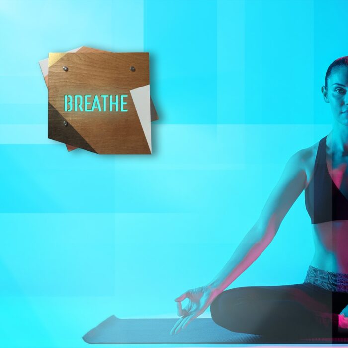 BREATHE - REBELlamps.com wooden LED sign with pink light on